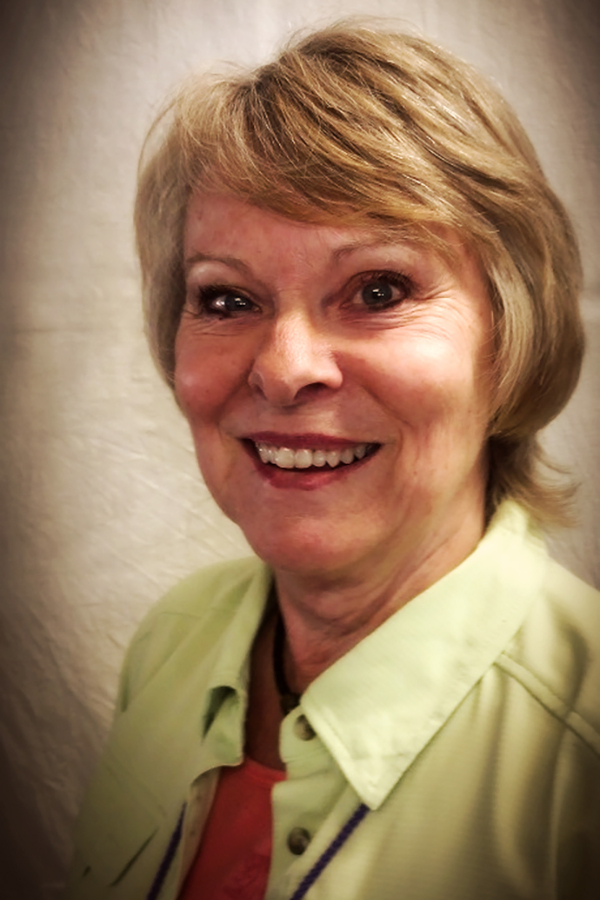 Portrait of Coralee Erickson, Broker/REALTOR®.